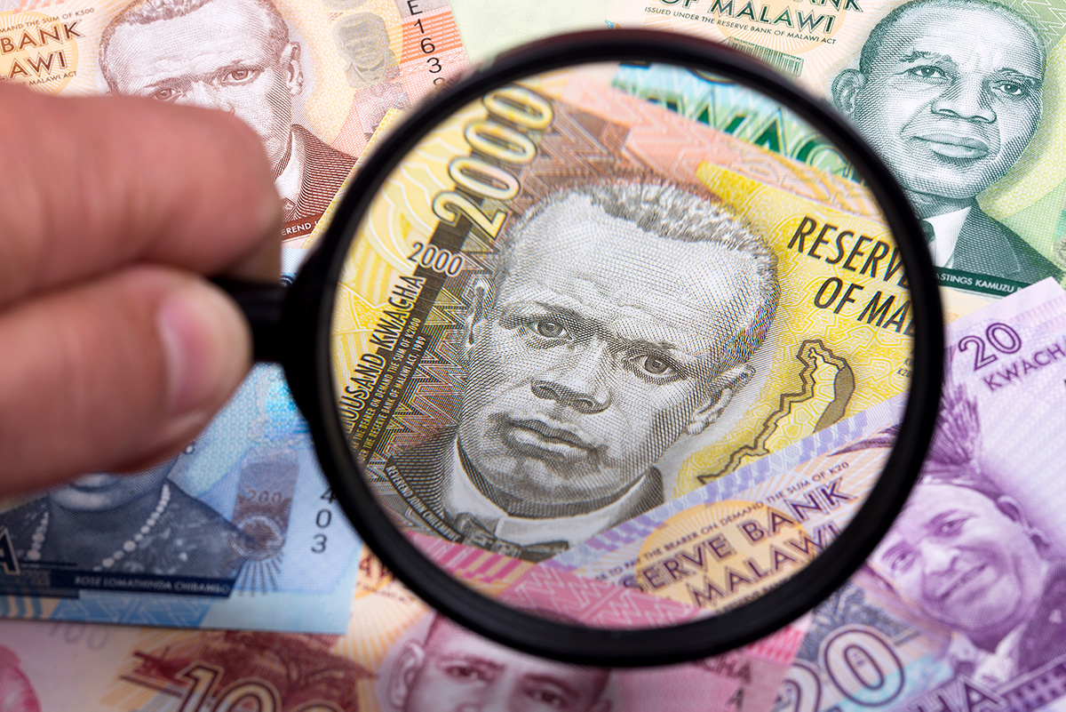 Malawi Kwacha and magnifying glass