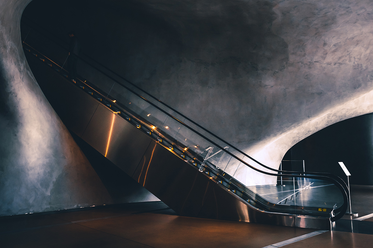 Escalator down into a dark space